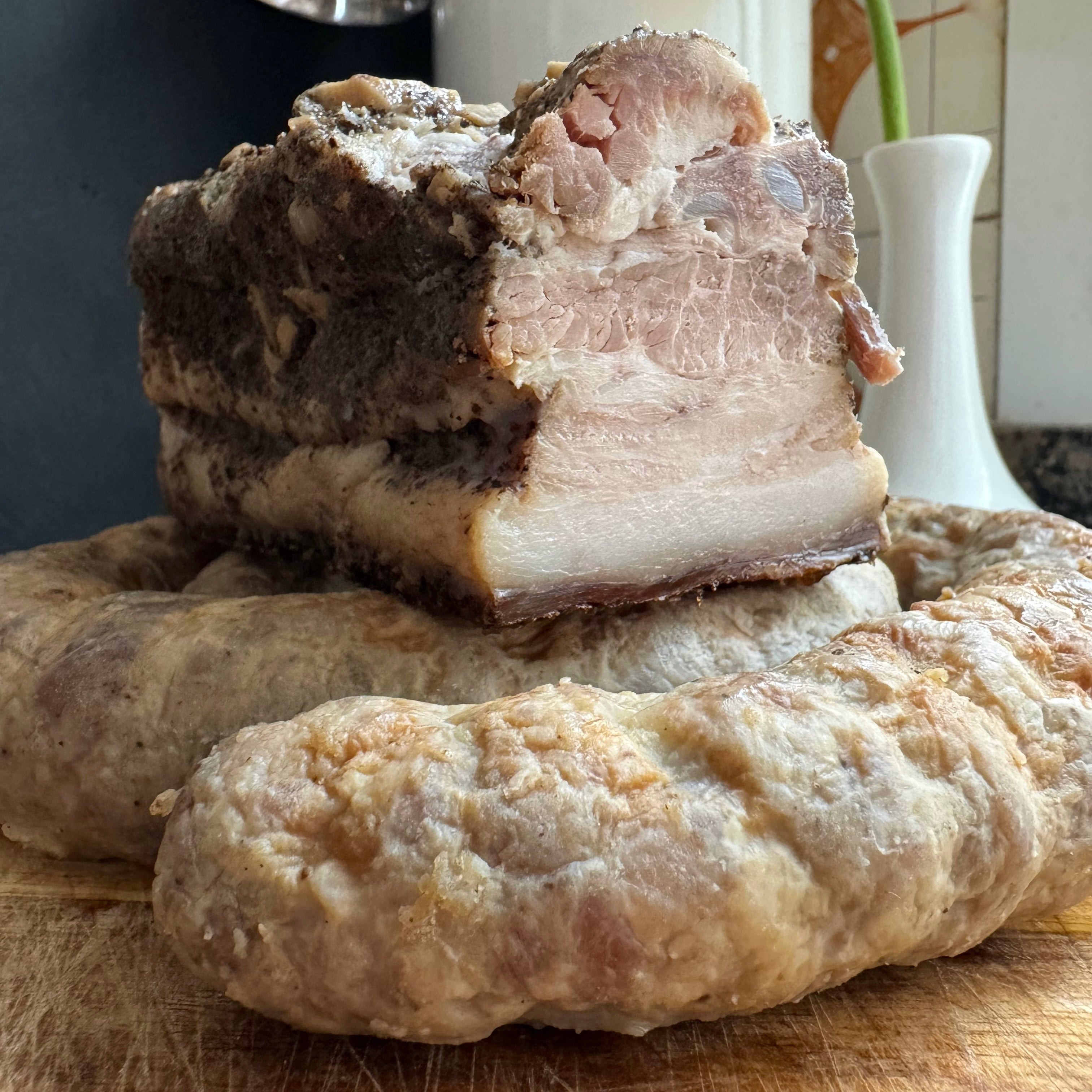 Salchicha casera y panceta al horno